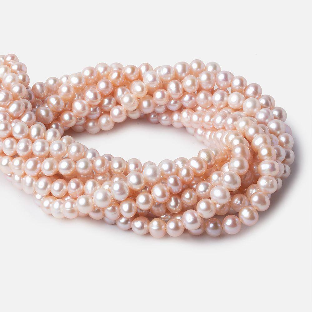 7x6mm Orchid Pink Off Round Freshwater Pearls 67 pieces AAA