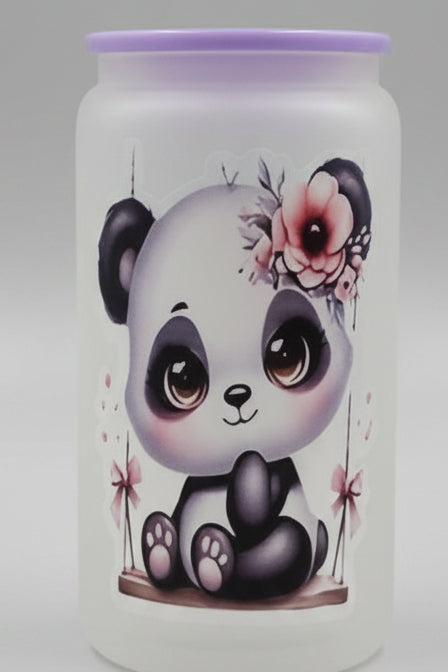 A frosted glass tumbler with a purple lid, featuring a cute cartoon panda illustration with a flower crown, displayed on a white and blue rotating stand.