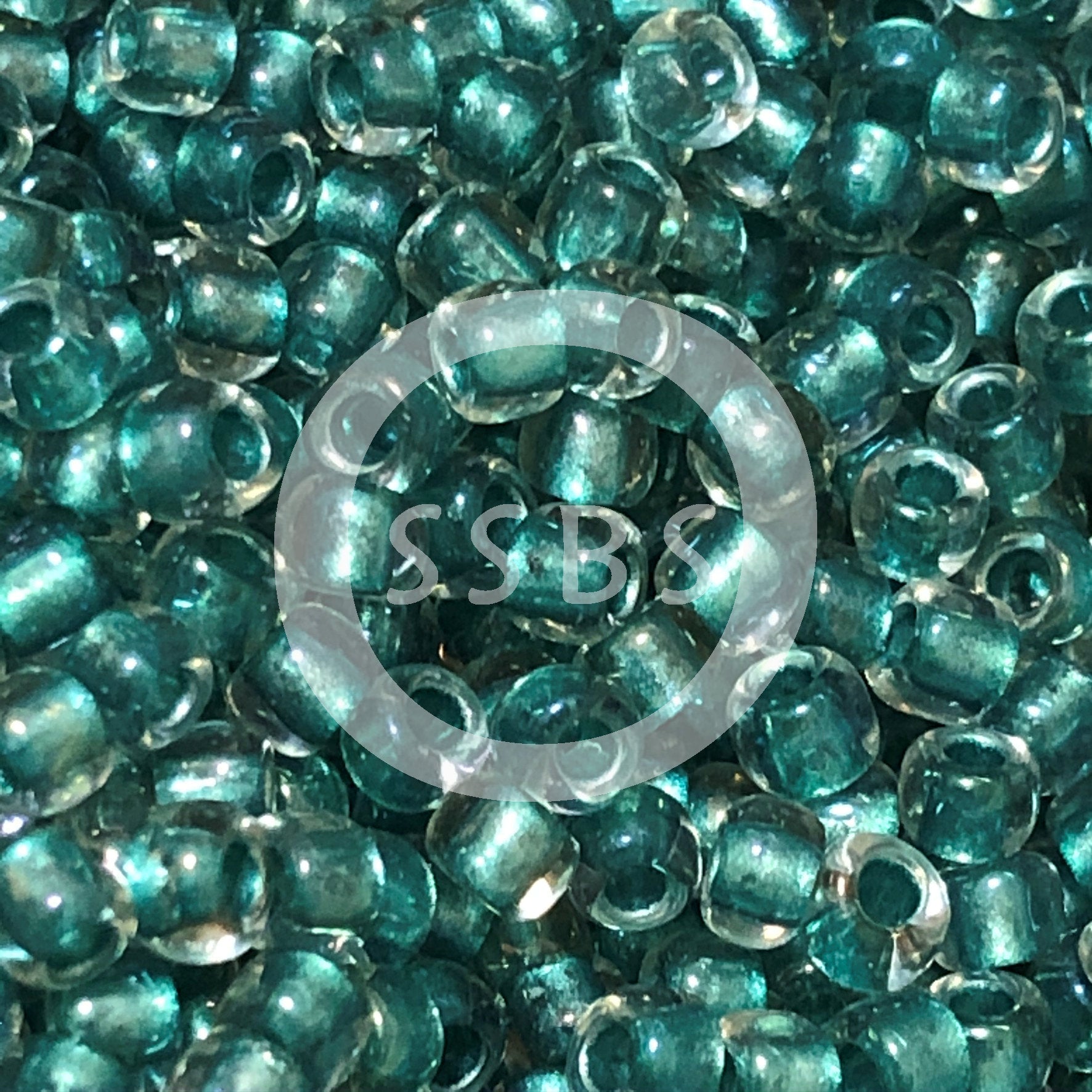 TOHO TR-08-264   8/0 Teal Lined Crystal Rainbow Seed Beads, 5 or 10 Grams